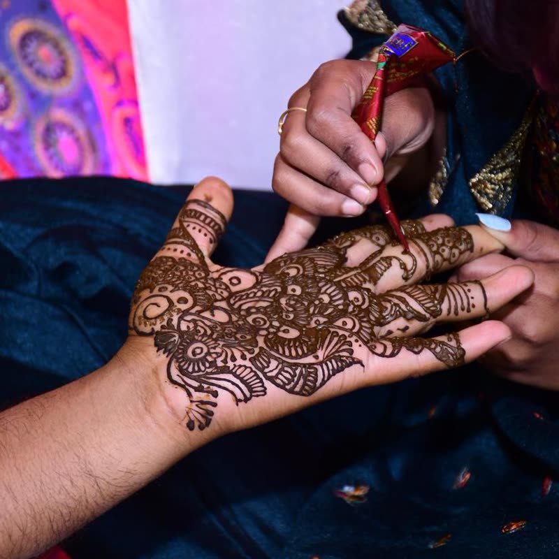 Henna being applied by hand for a Mehendi ceremony
